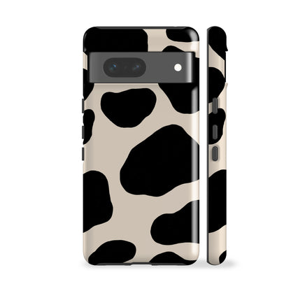 a phone case with a black and white cow print