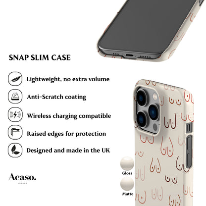 The image is a product image for a Snap Slim Case designed for an iPhone. It features a close-up view of the case and a full-body view of the phone case. The case has a design with a pattern of red and white breasts on a white background. The image includes text describing the features of the case, such as its lightweight design, anti-scratch coating, wireless charging compatibility, raised edges for protection, and that it is designed and made in the UK.